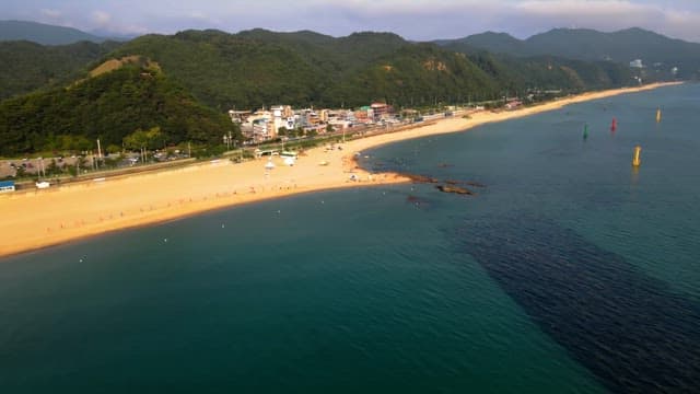 Scenic beach with a nearby town