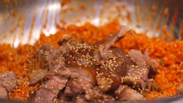 Bibimbap made of pig trotters and julienne Korean radish salad with sesame seeds