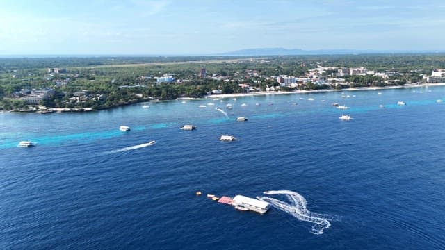 Coastal town with boats on the blue sea