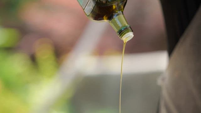 Olive oil drizzled over fresh steaks