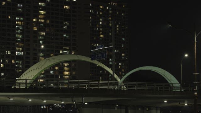 Night View of Bridge and City Apartments