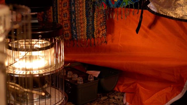 Illuminated heater in a cozy tent