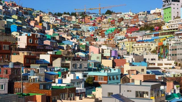 Day to night view of a Gamcheon Culture Village with colorful residential buildings