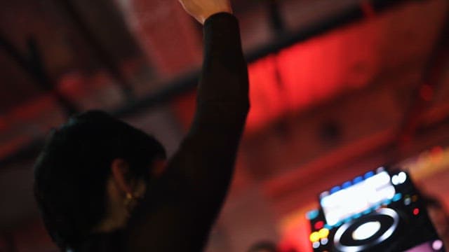 DJ Dancing Passionately with Angel Wings