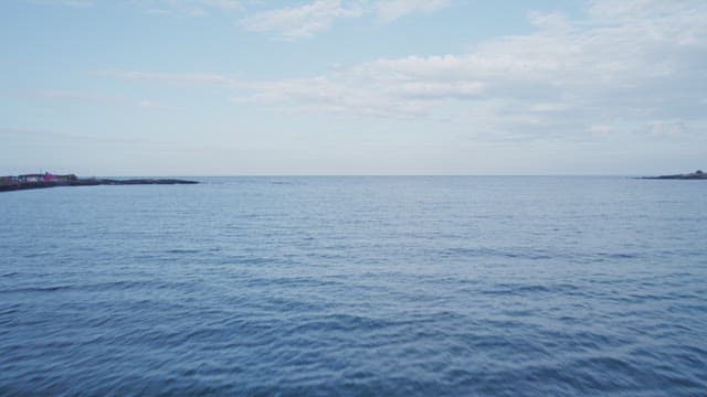 Calm ocean under a clear blue sky