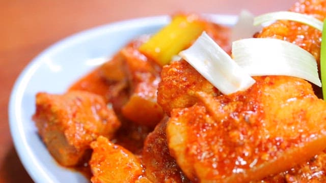 Close-up of Spicy Glazed Pork Dish