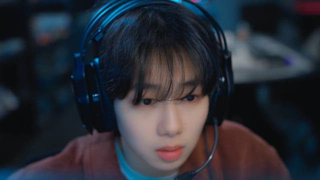 Gamer with headset focused on a screen