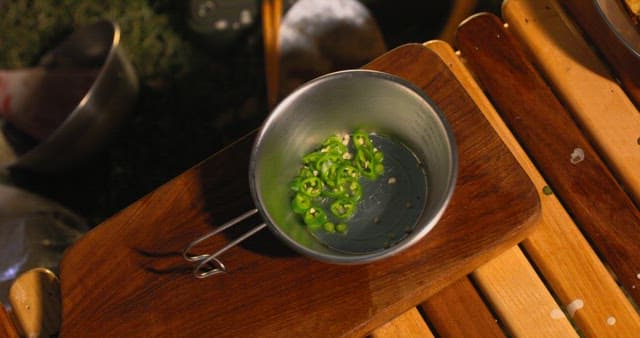 Preparing a spicy sauce in a cup