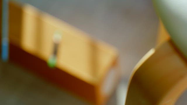 Colored pencil on a desk in a sunny room