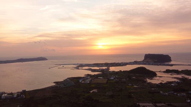 Sunset over a coastal village and sea