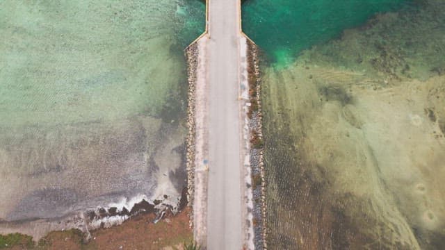 Bridge over clear turquoise sea