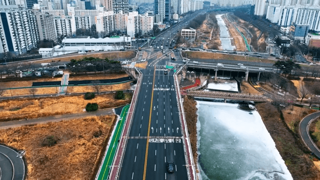 Road next to the River and Cityscape