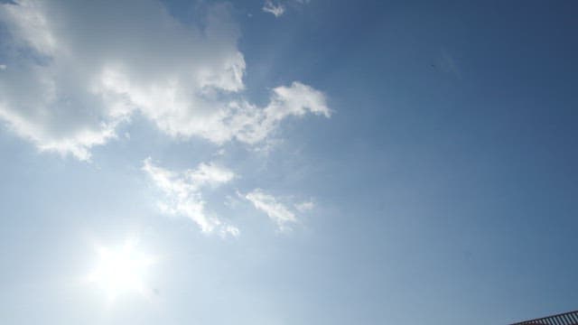 Sunlight shimmering on sea by the bridge