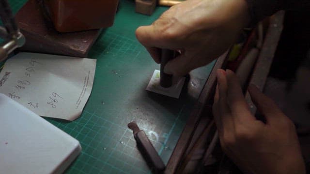 Craftsman Applying Seal on Paper