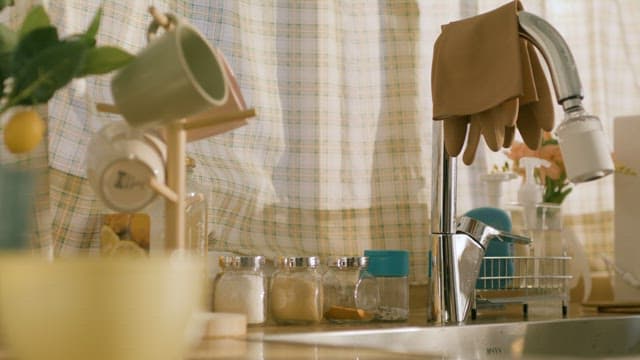 Cozy Sink Scene with Decorative Checkered Curtains