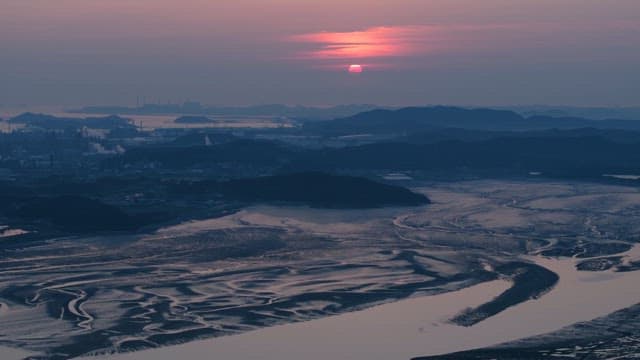 Winding River Estuary Under Serene Sunset