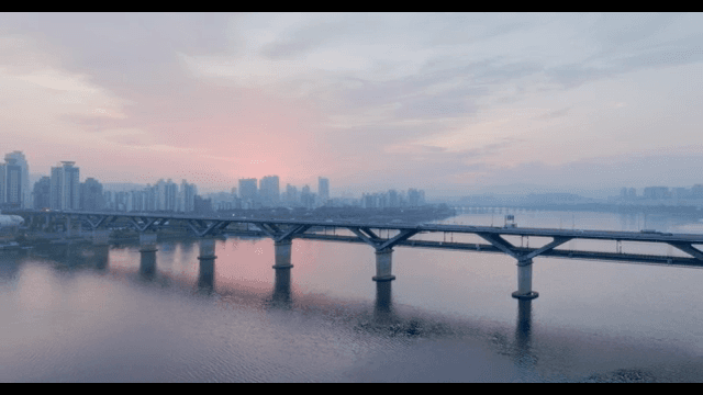City skyline with a bridge at sunset
