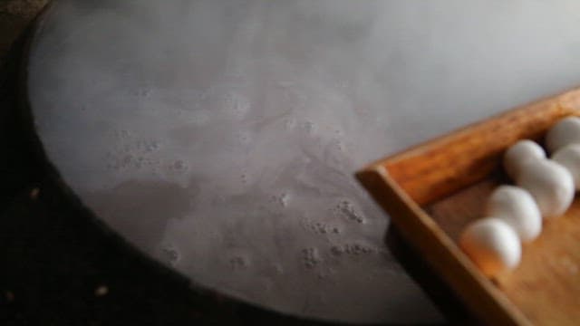 Making Red Bean Porridge with Rice Balls in a Steaming Cauldron