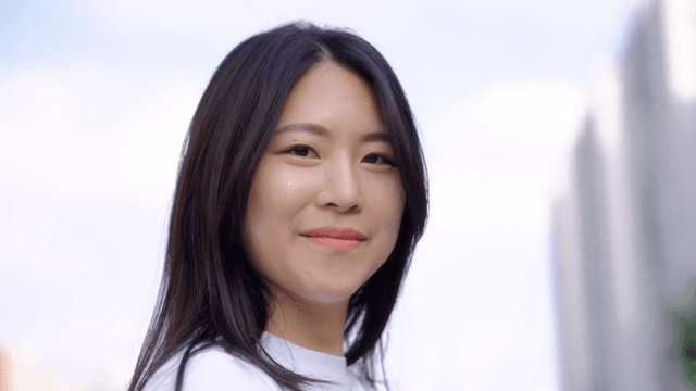 Woman smiling outdoors in the city