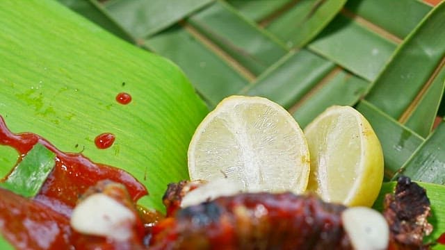 Grilled insects with sauce and lemon