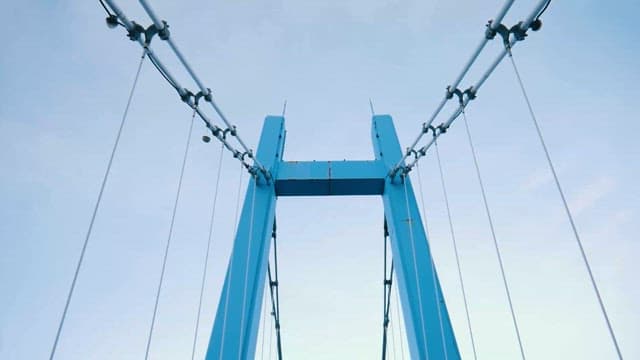 Sturdy Bridge Connecting Lush Green Hillsides