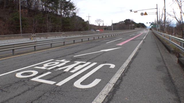 CCTV on a Secluded Highway under Cloudy Sky