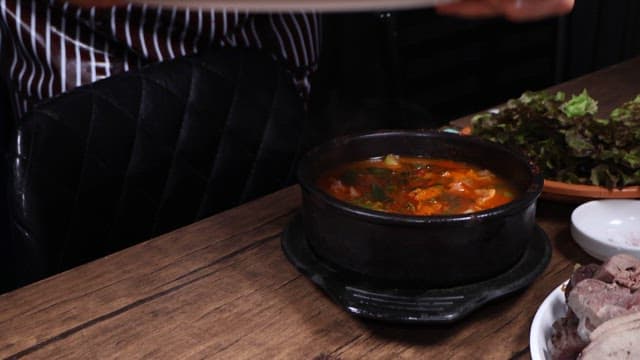 Glossy pig's feet served on a restaurant table
