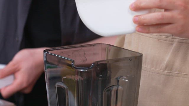 Preparing Carrot Juice with Blender in the Kitchen