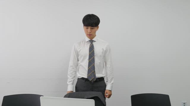 Man wearing suit jacket leaving office