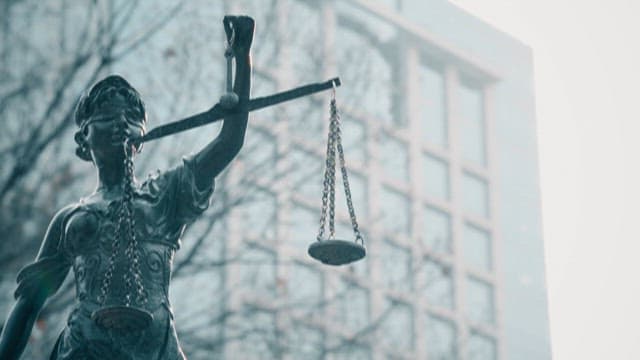 Statue of Justice in an Urban Setting