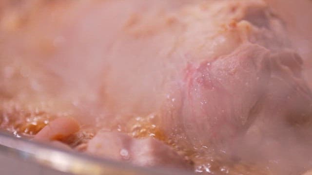 Pig's feet boiling in a pot