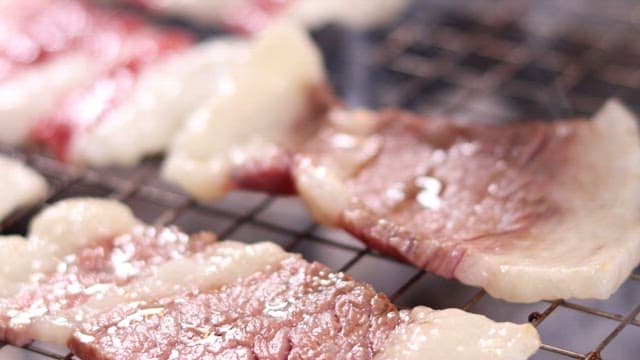 Beef brisket sizzling on the grill