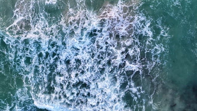 Waves crashing on the ocean surface