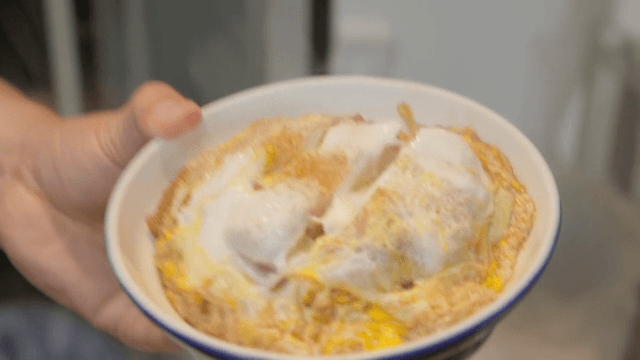 Katsudon made by placing egg-covered pork cutlet on top of rice in a bowl
