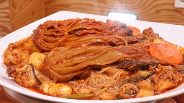 Aged Kimchi Dish Neatly Plated on a White Plate