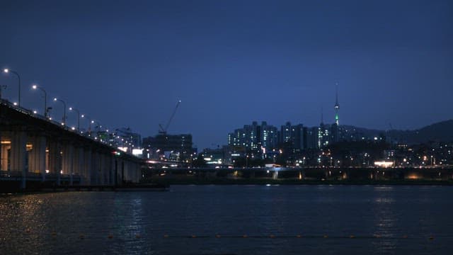 Dusk View of City Skyline and River