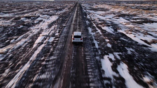 Car driving on a snowy road