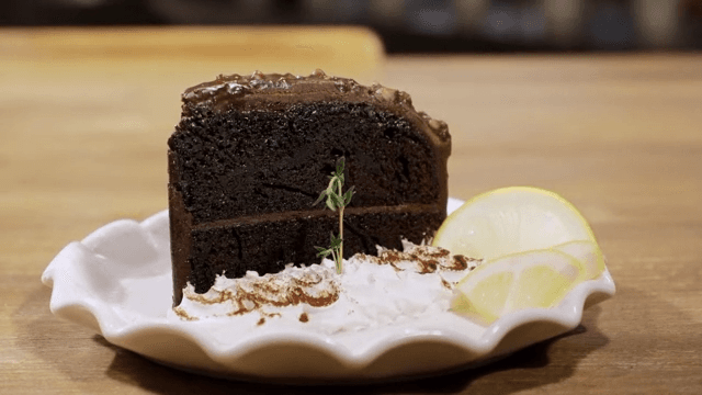 Chocolate cake with lemon slices on a plate