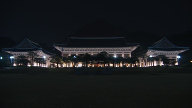 Illuminated Blue House at night