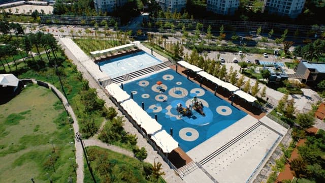 Aerial view of a modern playground and sports court
