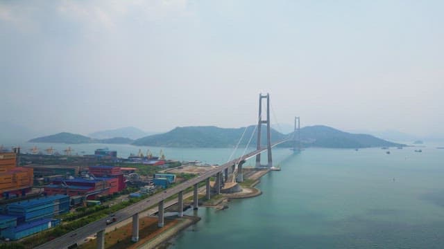 Large suspension bridge over calm sea