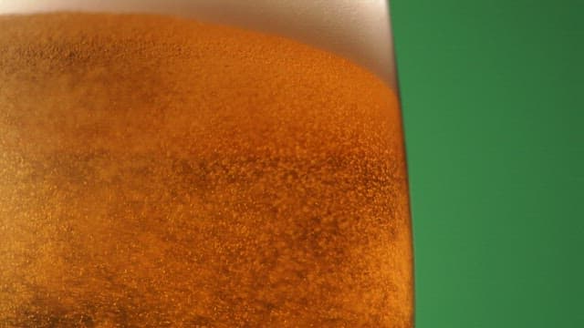 View of beer glass with bubbles rising