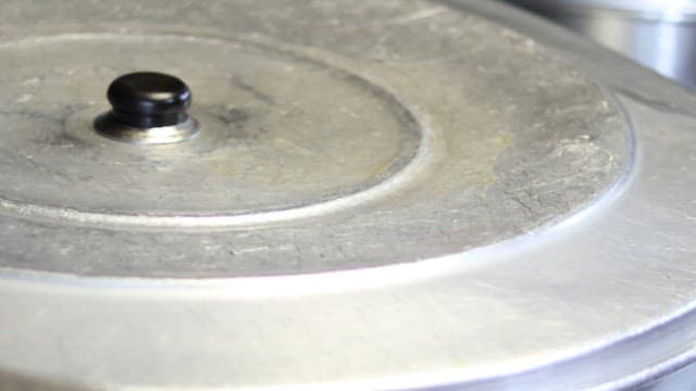 Pig's feet cooked in a large cauldron