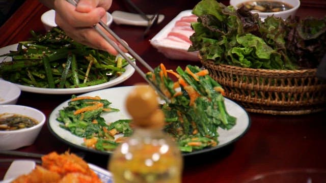 Hearty table with chive salad, chive pancake, and lettuce