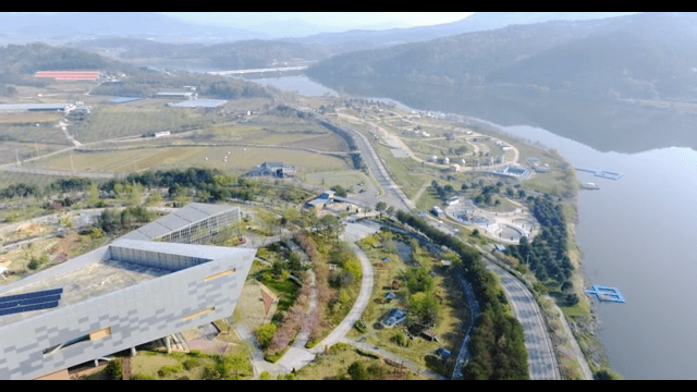 Scenic view of a modern building by a river