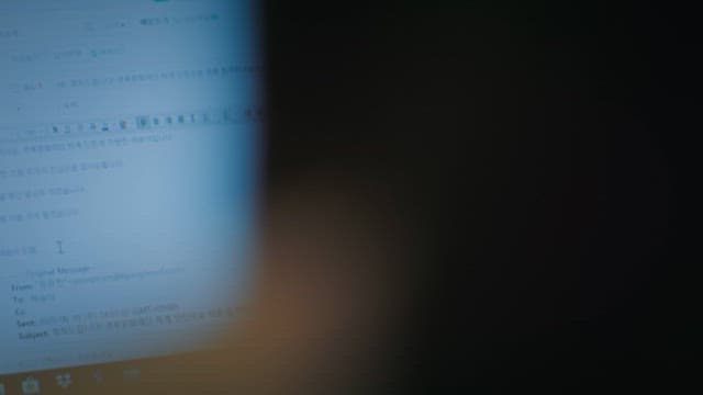 Over the shoulder view of computer screen