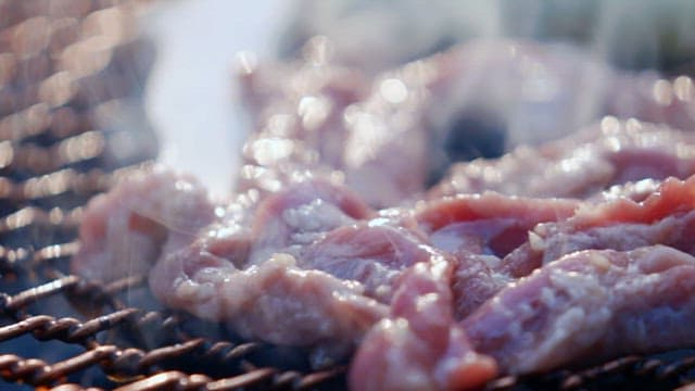 Meat grilling on a barbecue