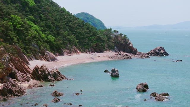 Serene beach with rocky cliffs