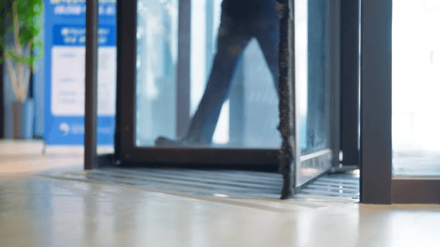 Person coming through revolving door