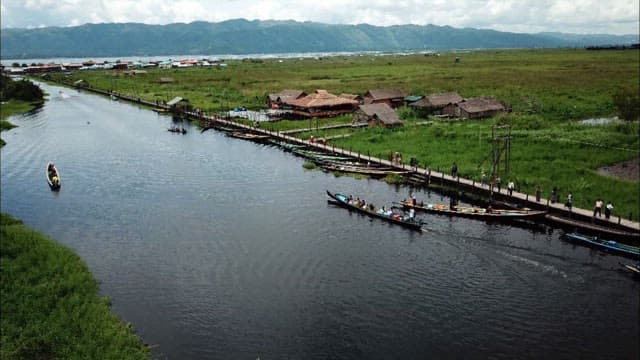 Boats Speeding Across a Scenic Inle Lake